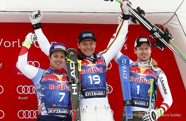 Thomas Dressen (mitte) Gewinnt vor Beat Feuz und Hannes Reichelt in Kitzbuehel.