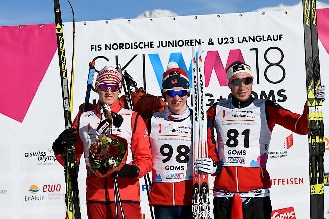 Junioren-WM 10 km (klassisch): Sieger Jon Rolf Skamo Hope aus Norwegen, flankiert von Sergej Ardaschew (RUS) auf Platz 2 und dem Drittplatzierten Jörgen Lippert aus Norwegen. 